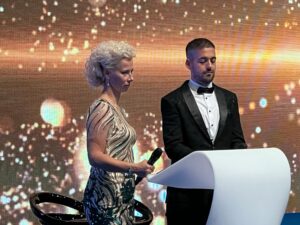 Judge evaluating dogs in the ring at the World Dog Show Geneva during international competition